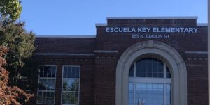 front of school with flag